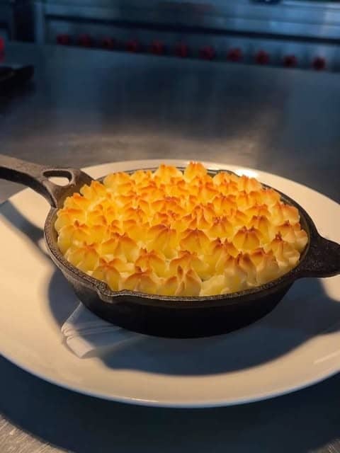 A fisherman's pie in a cast iron pan